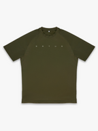 Green athletic t-shirt with 'BSTUS' branding on a white background
