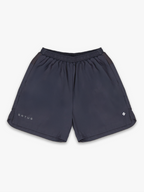 Grey training shorts with 'satus' branding on a white background